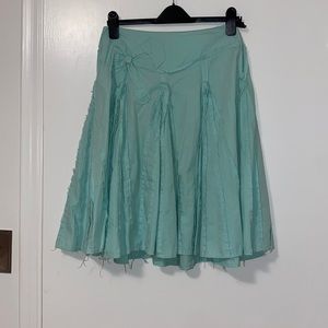 Hand stitched a-line skirt with external stitching